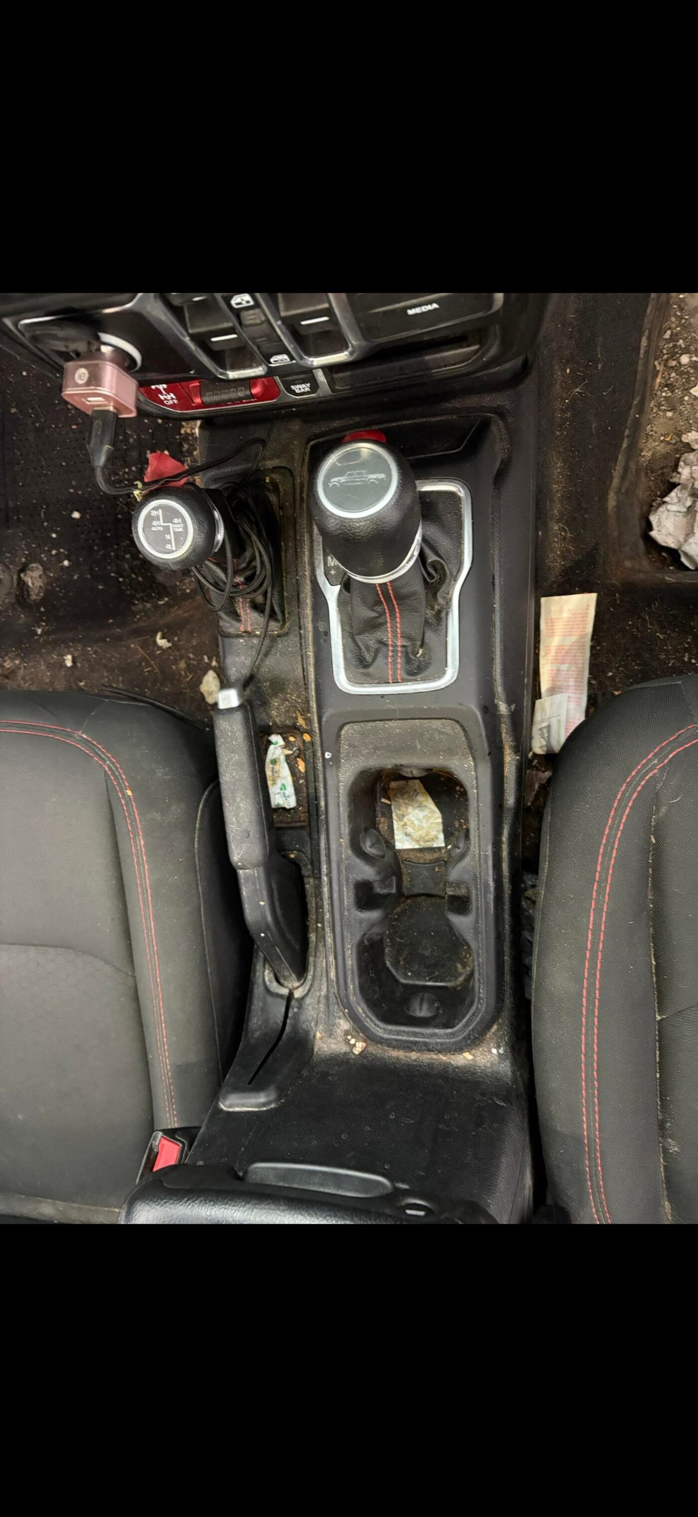 Dirty car console before detailing