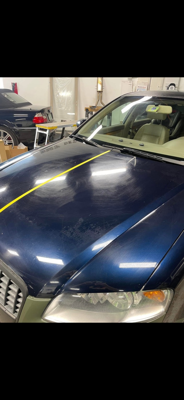 Glossy blue hood reflection after correction